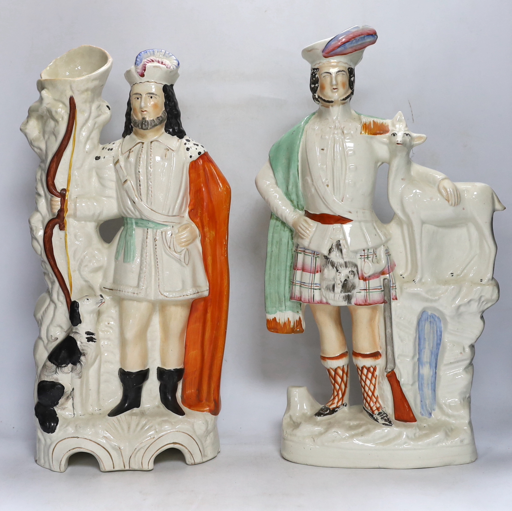 A pair of large mid 19th century Staffordshire pottery highland hunters, on horseback and three other Staffordshire pottery groups, largest 44 cm high (5)